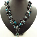 Volle halsketting met paua schelp parelmoer, onyx en koraal