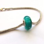 Turquoise glaskraal met luchtbellen