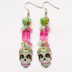 Halloween oorbellen groen roze doodshoofd