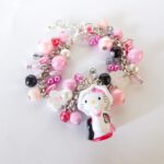 Volle Hello Kitty bedelarmband in wit met roze